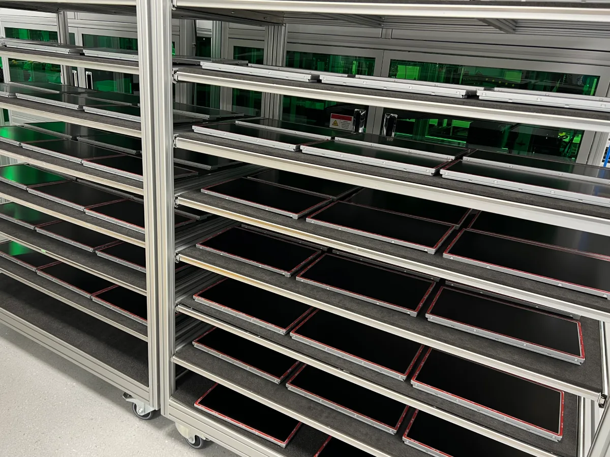Bonded display assemblies racked for production at scale